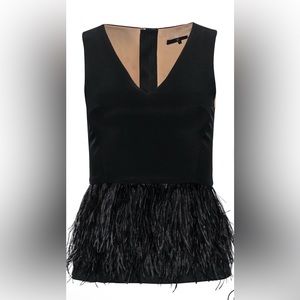 Tibi black sleeveless peplum top with ostrich feathers.Bought from the real real